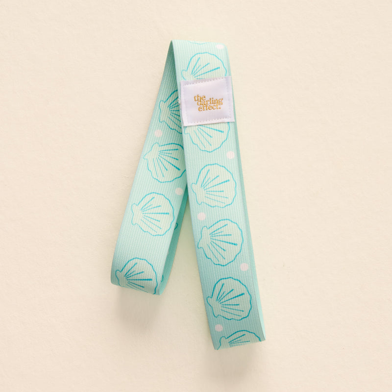 Put Towel Band-Seashells Aqua Stay