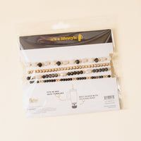The-darling-effect’s Midnight Glam Tumbler Bracelet Stack includes three beaded bands in black, gold, and pearl—ideal for 30 & 40 oz tumblers and pairs perfectly with a silicone boot. Labeled “it’s a lifestyle.”.