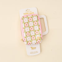A stylish, water-resistant "Flower Check Green Tumbler Fanny Pack" by The Darling Effect with a pink, white, and green floral checkerboard design, shown in its packaging against a light beige background.