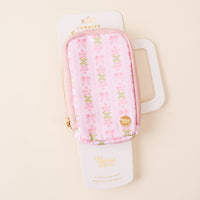 The Oh So Fancy Pink Tumbler Fanny Pack by the-darling-effect features a pink floral and bow-patterned, water-resistant zippered pouch attached to white packaging labeled with the product name on a light beige background.