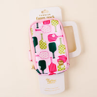 The Pickleball Party Tumbler Fanny Pack by the-darling-effect is a small, pink, zippered pouch with colorful paddle patterns, shown on white packaging. It’s water resistant and displayed against a light beige background.