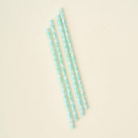 Four light blue reusable straws with a white floral pattern are arranged parallel to each other on a plain off-white background—perfect as eco-friendly straws for your 40 oz tumbler.