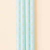 A close-up, vertical shot features several the-darling-effect Oh So Fancy Blue 40 oz Tumbler Straws, all BPA-free and patterned, displayed against a pale peach background.