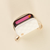 White Check Zip Around Wallet by the-darling-effect, a white zip-around compact wallet with a checkered pattern and gold key ring, holding a credit card inside.