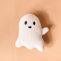 The Darling Effect Ghost Throw Pillow features a plush sherpa design shaped like a smiling white ghost with black eyes, a black mouth, and one raised arm—perfect for adding spooky-cute Halloween decor to your space.