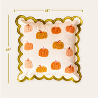A Pumpkin Patch Scalloped Square Throw Pillow, featuring an 18-inch square white base with embroidered orange pumpkins and a scalloped green border.