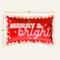 Merry & Bright Scalloped Rectangle Throw Pillow in red with a scalloped pink border, textured lettering, and small white embroidered stars.