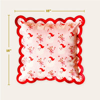 Add a cozy touch to your holiday decor with The Darling Effect’s Holly Jolly Santa Scalloped Square Throw Pillow—an 18"x18" pillow featuring festive Santa faces, bows, and holly on light pink with a red scalloped border.