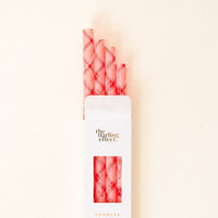 A white box labeled "The Darling Effect" displays the Festive Plaid 40 oz Tumbler Straw Set, with pink and red plaid reusable straws visible through a clear window at the top.