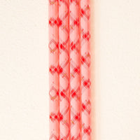 Five reusable straws from The Darling Effect's Festive Plaid 40 oz Tumbler Straw Set are aligned vertically on a cream background—eco-friendly and perfect for your 40 oz tumbler.
