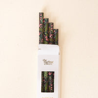 A white box labeled The Darling Effect holds the Jolly Sprig Green 40 oz Tumbler Straw Set, featuring BPA-free straws with floral and leafy designs, partially sticking out against a light background.