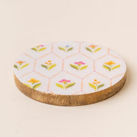 The-darling-effect's Handpicked for You Wood Enamel Coaster features a white enamel top with a geometric floral and green leaf pattern—making it a charming decorative addition to your coaster collection.