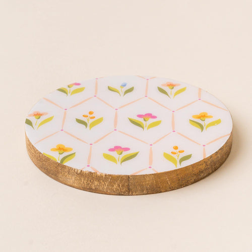 The-darling-effect's Handpicked for You Wood Enamel Coaster features a white enamel top with a geometric floral and green leaf pattern—making it a charming decorative addition to your coaster collection.