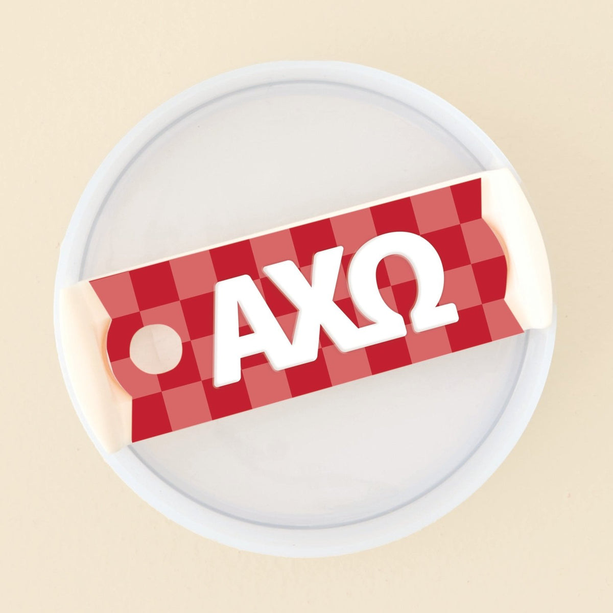 The Darling Effect Alpha Chi Omega Tumbler Lid Tag is a red and white checkered acrylic tag featuring Greek letters AXΩ, designed to attach to the rim of a round white container lid—perfect for personalizing your 40 oz tumbler or creating unique sorority tumbler lid tags.