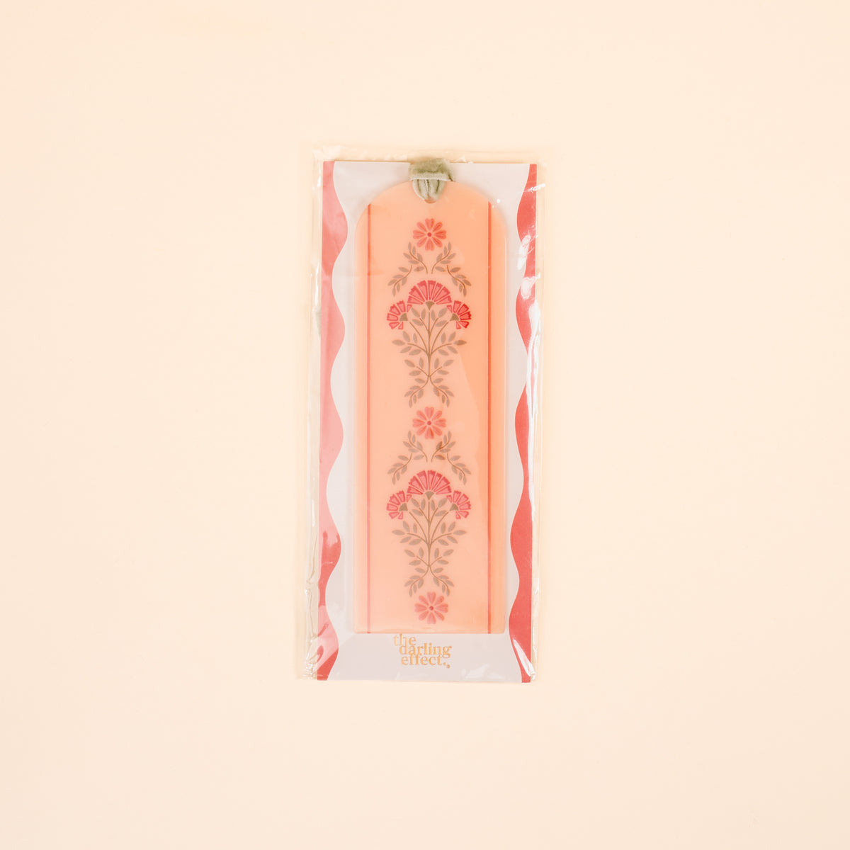 The Everbloom Dusty Rose Acrylic Bookmark by The Darling Effect features a floral design, green velvet ribbon tassel, and comes packaged in plastic—a charming gift for book lovers.