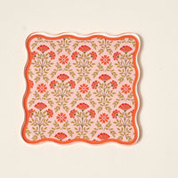 Pair The Darling Effect’s Everbloom Dusty Rose Table Talk Acrylic Coaster Set with a wavy-edged square tray featuring red and pink florals on light pink for an elevated, stylish table decor.