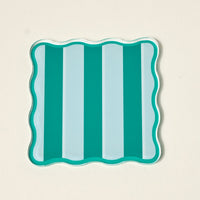 The Darling Effect's Sicily Stripes Teal Table Talk Acrylic Coaster Set features a square tray with wavy edges and vertical teal and light blue stripes on cream, ideal as stylish décor or paired with the coasters for added function.