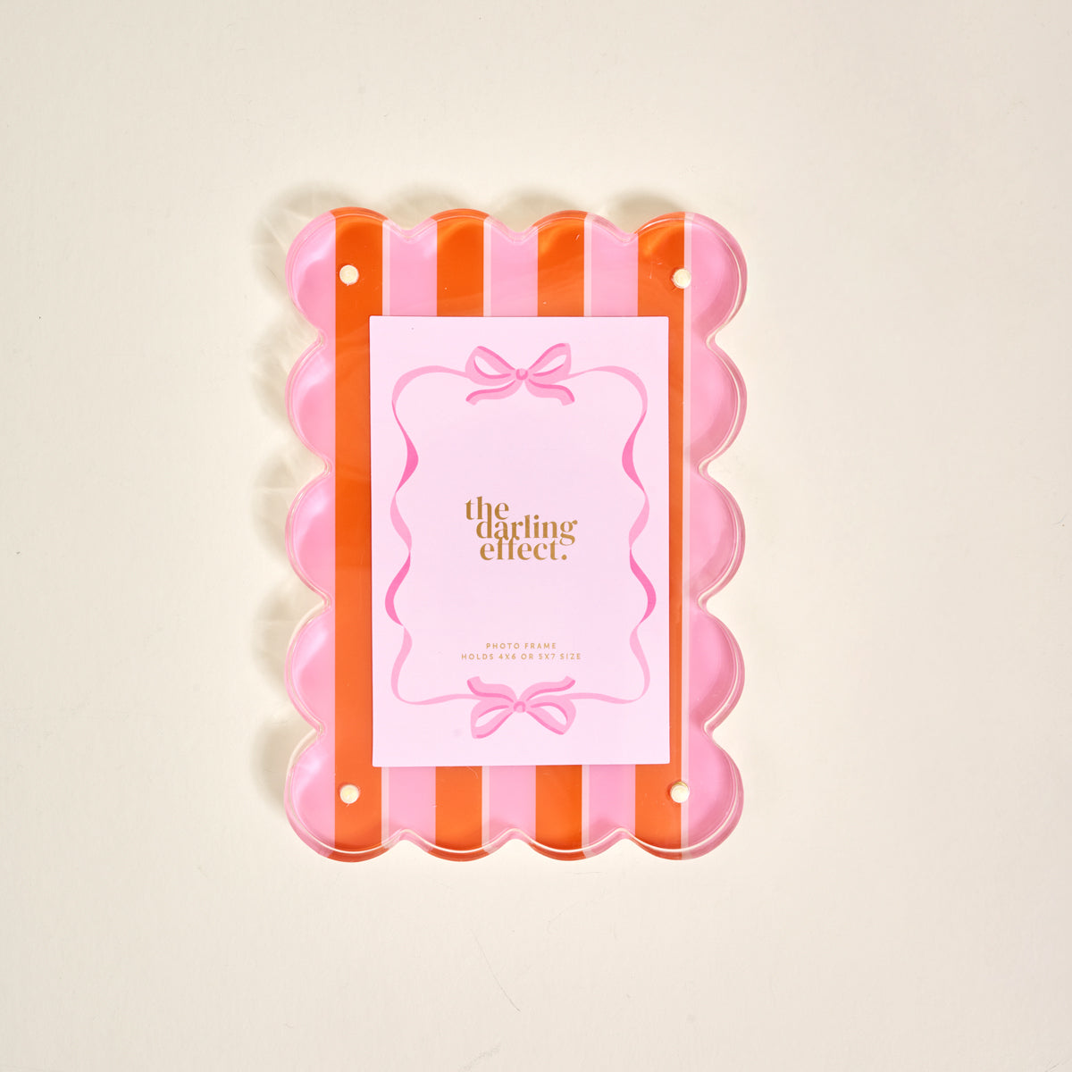 Showcase your photos in style with The Darling Effect Sicily Stripes Pink Rectangle Scalloped Acrylic Picture Frame, featuring chic pink and orange stripes and a clear scalloped design—perfect for modern décor lovers.