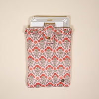 The Everbloom Dusty Rose Book Cover features a pink and red floral pattern, puffy polyester protection, a snap button closure, and charming hints of white pages with black lines on a light beige background.