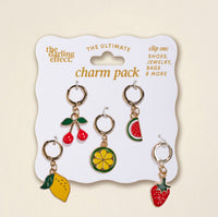 The Darling Effect’s Fruit Frenzy The Ultimate Charm Pack includes five gold hoop fruit charms—cherry, lemon slice, watermelon slice, lemon, and strawberry—perfect for charm packs or pairing with statement necklaces.