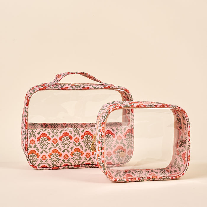 The Darling Effect Everbloom Dusty Rose Clearly Chic Cosmetic Bag Set features two pink floral print clear bags, ideal as stylish organizers for your makeup and essentials.