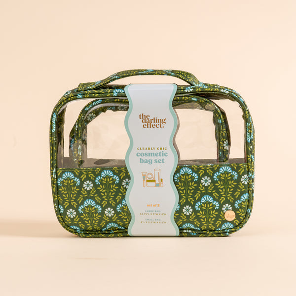 The Darling Effect Everbloom Forest Green Clearly Chic Cosmetic Bag Set includes two floral cosmetic bags, ideal for travel or makeup storage, packaged in a clear window box.
