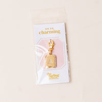 A Jewelry Charm Initial Letter Gold by the-darling-effect features a gold-plated “A” with rhinestone border, lobster clasp, and comes on an “oh so charming” branded card—perfect for personalized style.
