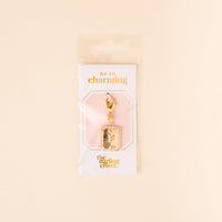 The F Jewelry Charm Initial Letter Gold by the-darling-effect is a gold-plated rectangular pendant with a clasp, packaged on an "OH SO charming" card. Perfect for anyone who loves personalized jewelry.