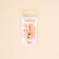 The H Jewelry Charm Initial Letter Gold by the-darling-effect features a gold-plated, rhinestone-encrusted letter H with a lobster clasp, packaged in plastic—ideal for adding personalized sparkle to your style.