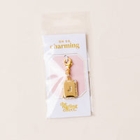 The-darling-effect J Jewelry Charm Initial Letter Gold features a gold-plated brass charm with a rhinestone-studded J, presented on an OH SO charming card and packaged in a clear plastic bag—perfect for personalized style.