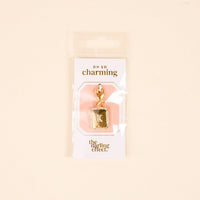 The-darling-effect K Jewelry Charm Initial Letter Gold, gold-plated and perfect for personalized jewelry, comes in rectangular OH SO charming packaging on a light beige background.