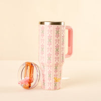The-darling-effect Oh So Fancy Pink 40 oz Lifestyle Flip Straw Tumbler features a delicate floral and ribbon pattern, pink handle, clear leak-resistant lid, and matching pink straw.
