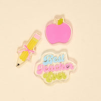 The Darling Effect's Best Teacher Ever Little Magnet Set features acrylic magnets—a pink apple, a yellow pencil with a pink bow, and a pastel cloud cutout—perfect for adding a decorative touch to any classroom or fridge.