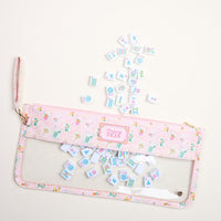 The Darling Effect's It's Mahj Time Pink Mahjong Tile Keeper Pouch features a transparent "Mahjong Tiles" section and keeps your tiles stylishly stored, with space for colorful tiles to spill out on display.