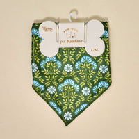 The Darling Effect's Bow-Wow Pet Bandana-Everbloom Forest Green features a blue and white floral pattern in L/XL cotton, packaged and ready for pets. Colors may vary due to lighting effects.