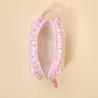 The Darling Effect's School's In Session Essentials Quilted Cosmetic Pouch features a pink ruffled design, zip closure, small handle, cute colorful exterior, and pastel striped lining shown from above with the zipper open.