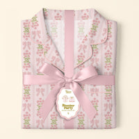 The Darling Effect’s Oh So Fancy Pink Slumber Party Pajama Shorts Set features a floral and bow pattern, ultra-soft fabric, and arrives gift-ready with a pink satin ribbon and a tag reading "Slumber Party Pajama Gift Set.