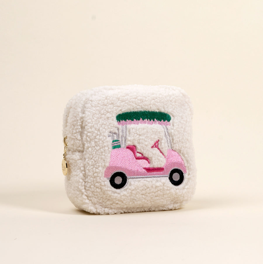 The Darling Effect's Square Golf Cart Teddy Pouch features fuzzy white sherpa fabric with a pink embroidered golf cart and clubs—an adorable addition to your teddy pouches or accessory collection.